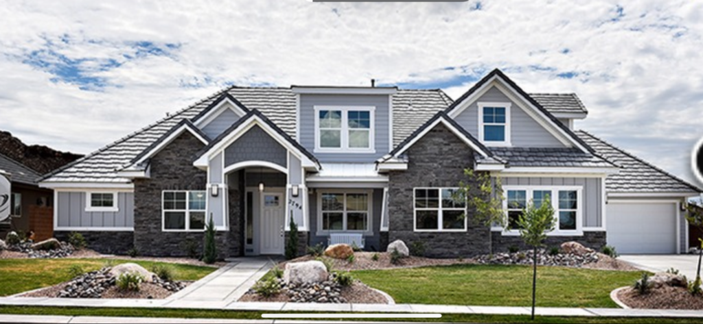 Stone and siding custom home Stone and siding custom home exterior with gabled rooflines in Southern Utah